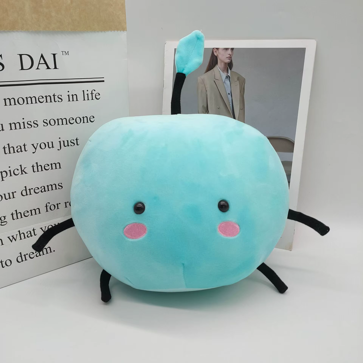 Blue Junimo plushie from Stardew Valley displayed on a table