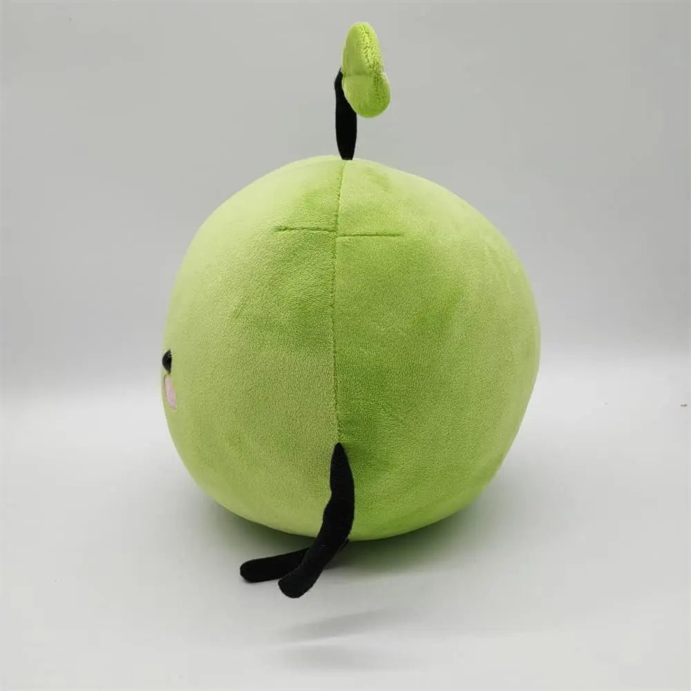 Green Junimo plushie from Stardew Valley shown from the side