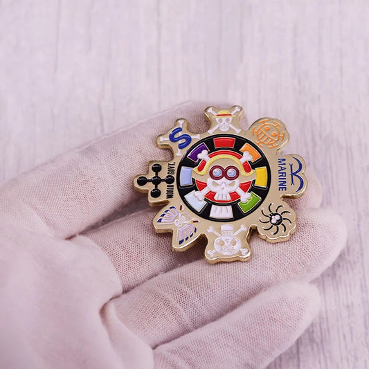 Close-up of a One Piece Jolly Roger pin held in hand.