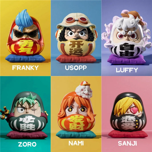 One Piece Straw Hat Daruma figurine collection featuring Franky, Usopp, Luffy, Zoro, Nami, and Sanji in a traditional Daruma doll design, each sitting on a cushion with vibrant colors.