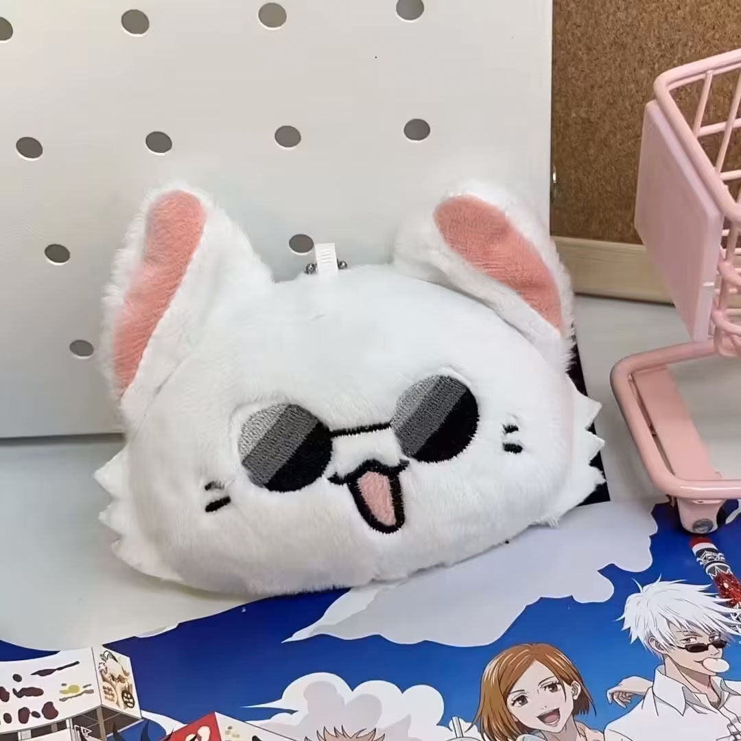 Plush keychain of an anime character, Gojo, with white body and pink inner ears, featuring sunglasses.