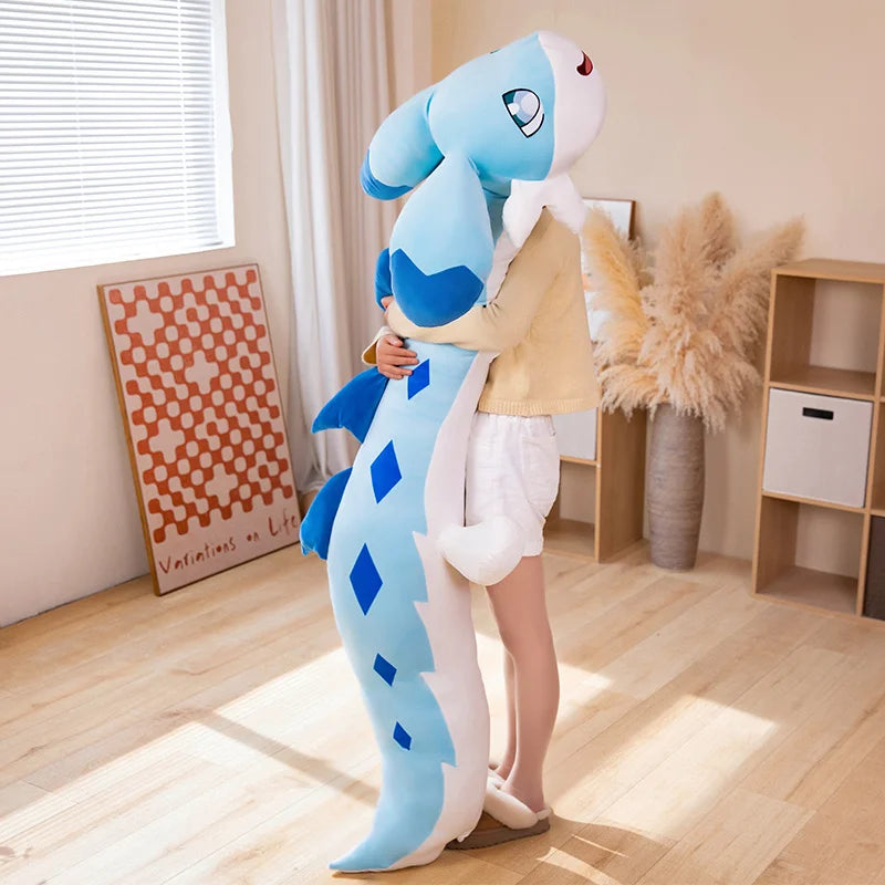 Palworld Chillet giant blue plush being hugged upright by a person, showing its long body, blue diamond markings and oversized ears.
