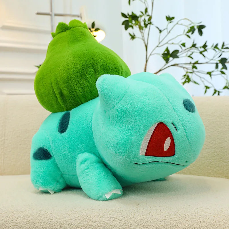 Blue Bulbasaur plush from the Bulbasaur Duo Set with the pink Bulbasaur in the background