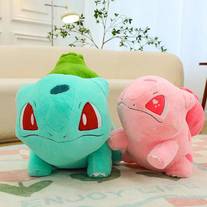 Blue and pink Bulbasaur plushies from the Bulbasaur Duo Set displayed together on a table