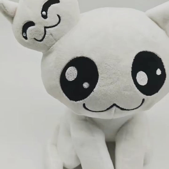 Handheld footage of Stacy Mewgenics plush toy rotating to show front, side, and back views