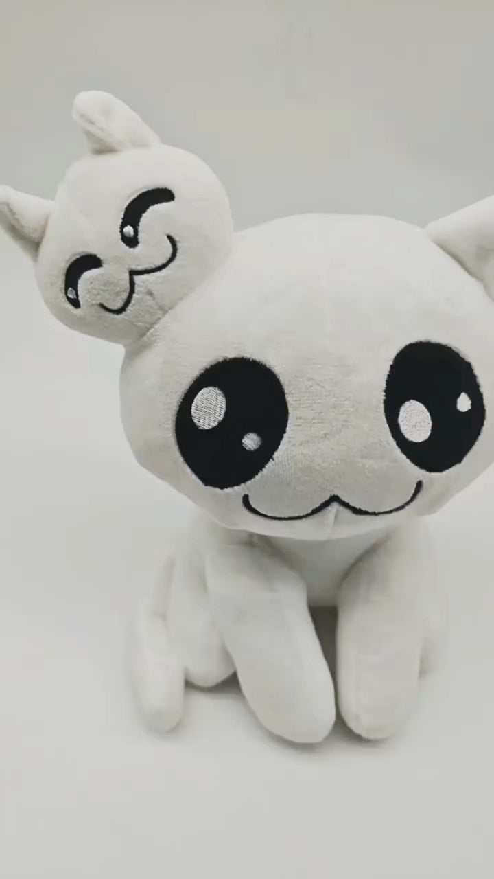 Handheld footage of Stacy Mewgenics plush toy rotating to show front, side, and back views