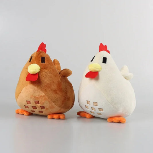 Two Stardew Valley chicken plushies, one white and one brown, displayed side by side.